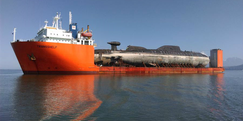 Illustration for article titled This Giant Russian Ship Is Toting Two Submarines